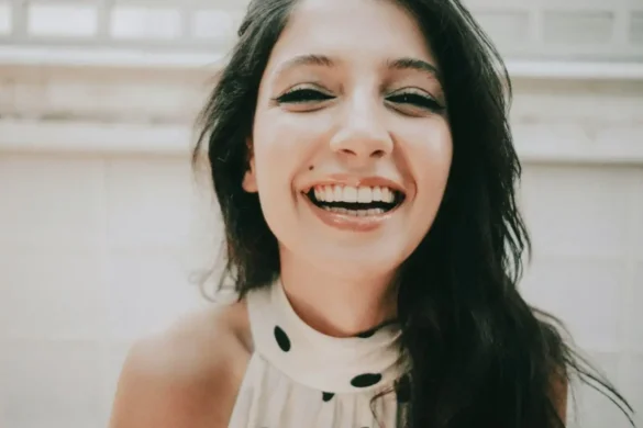 Laughing woman looking at camera.