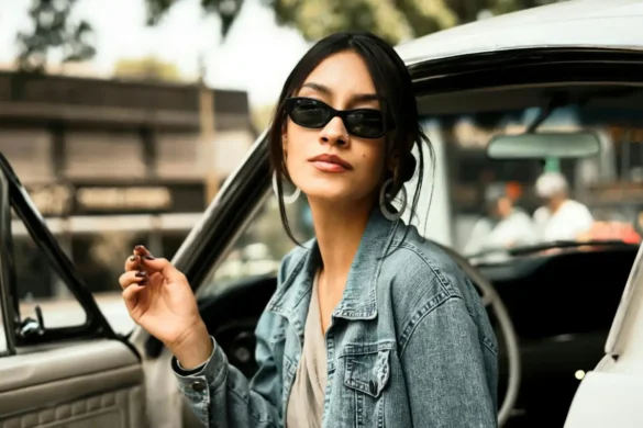 Woman with nonchalant expression sitting in a car.